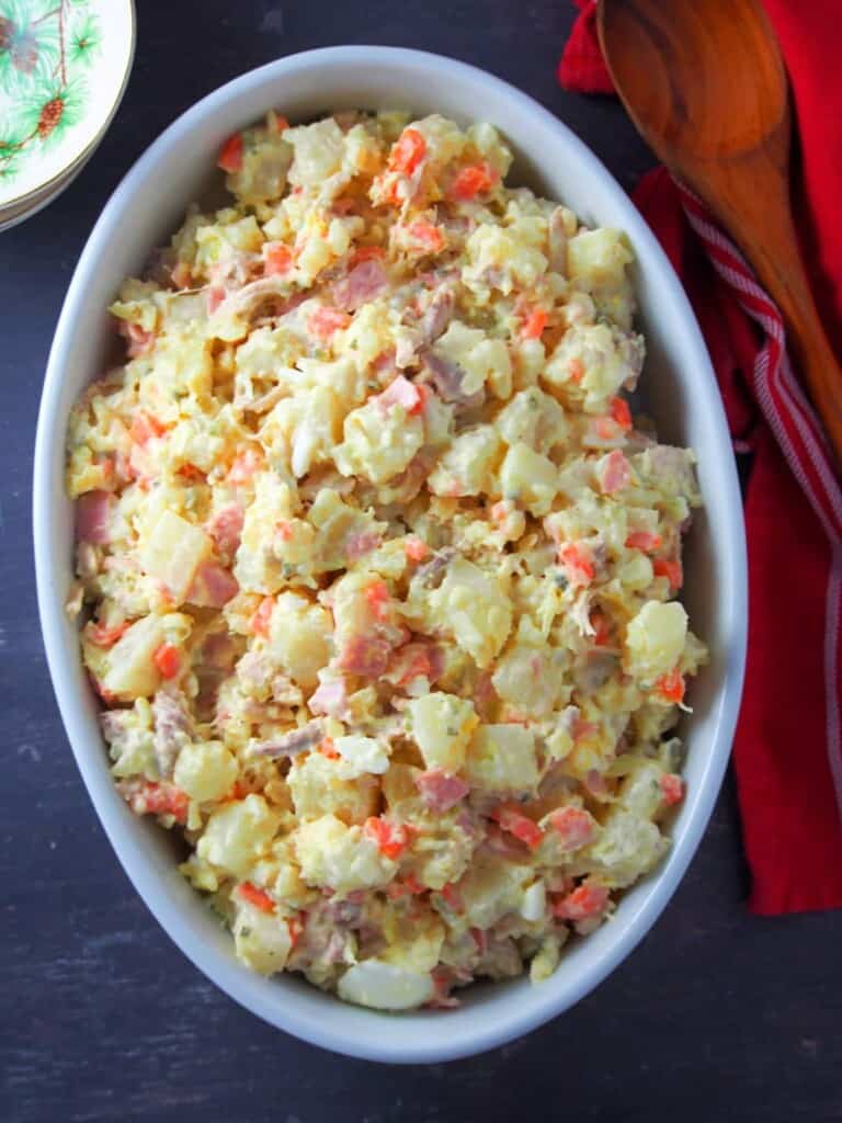 Filipino-style potato salad in a white casserole dish