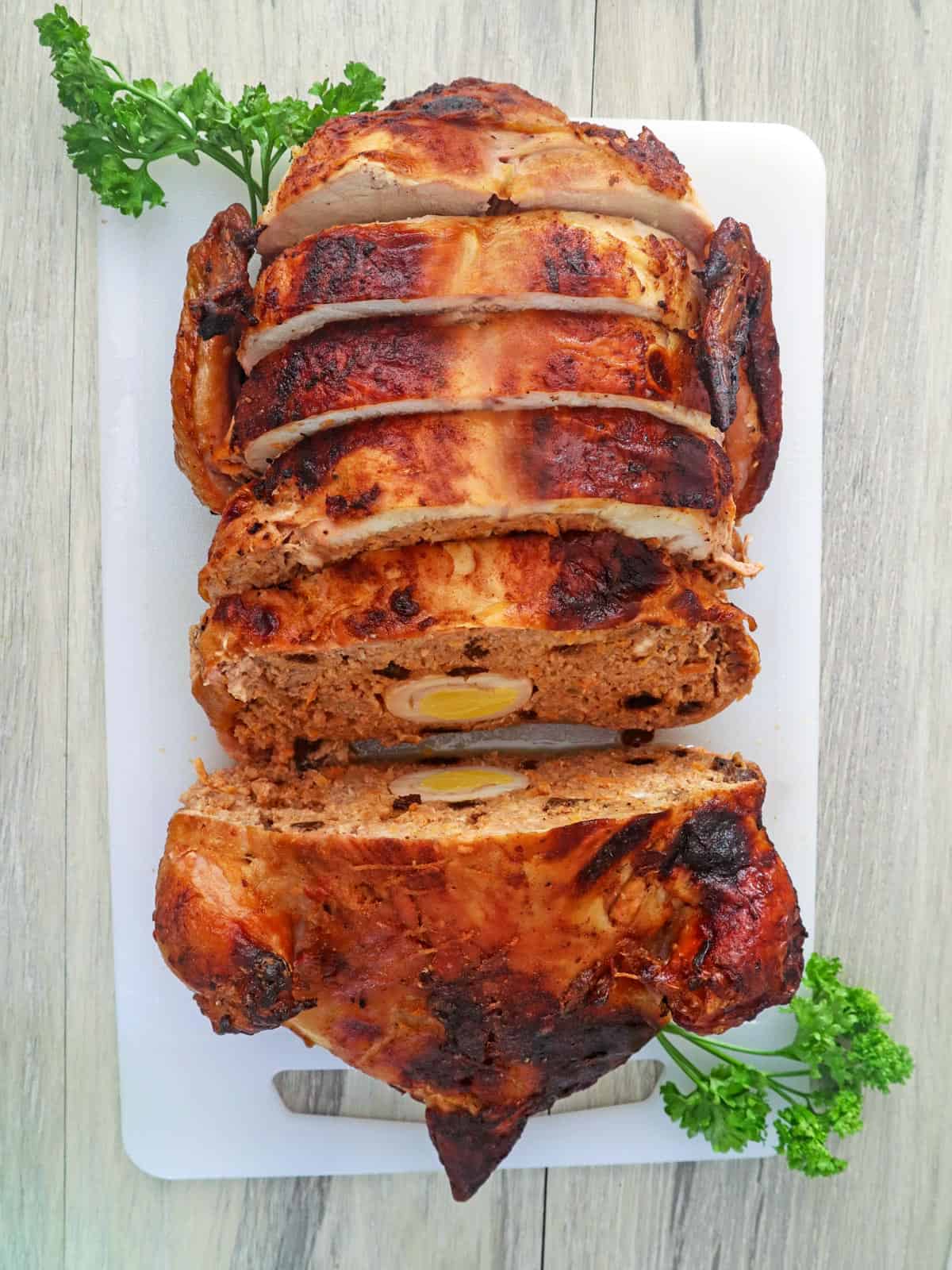 sliced Rellenong Manok on a cutting board