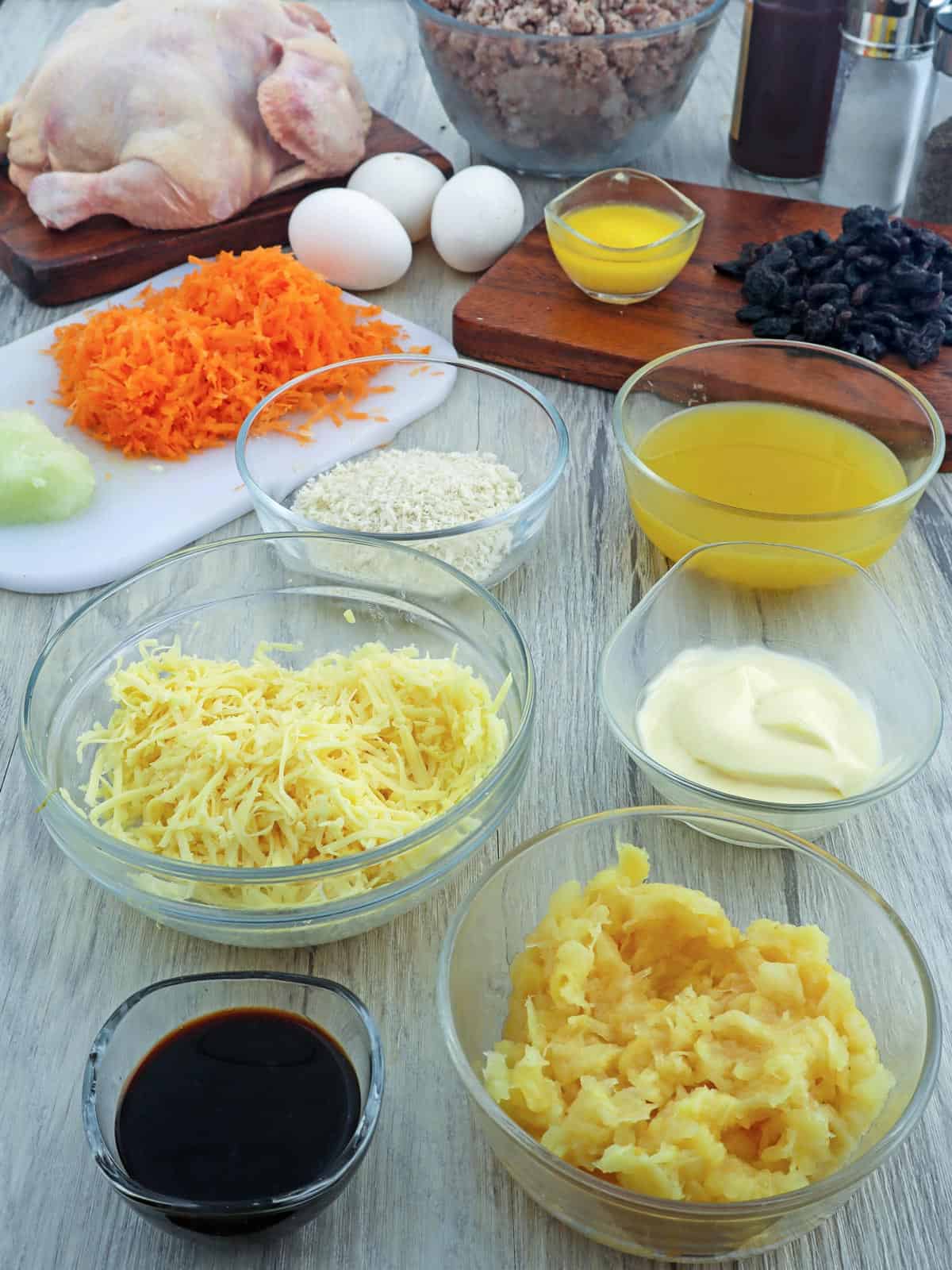 chciken, ground pork, shredded cheese, panko bread crumbs, carrots, onions, soy sauce, crushed pineapples, beaten eggs, mayonniase