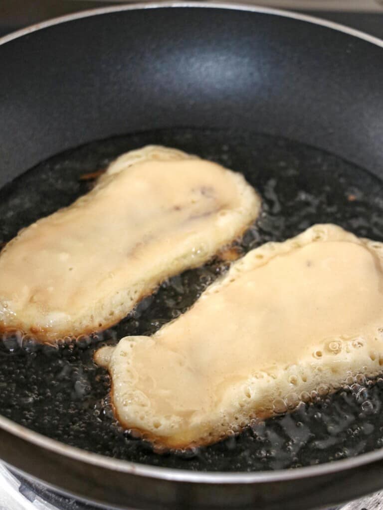 frying maruya in a wide pan