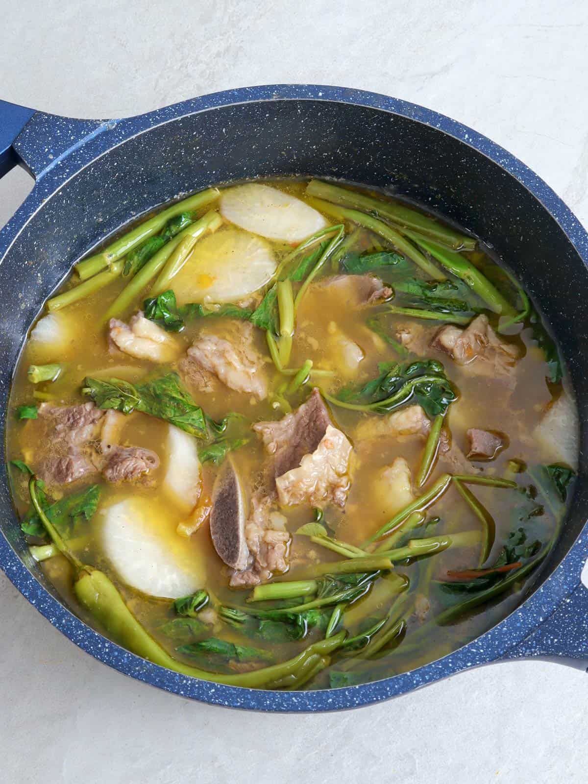 beef sinigang in a pot.