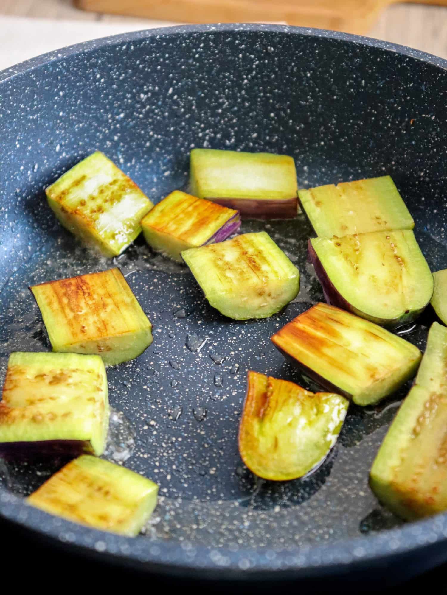 frying eggplants in a pan