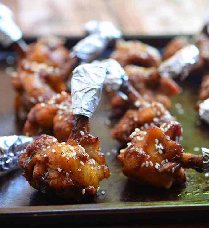 These plum sauce chicken lollipops are baked to perfection and dusted with sesame seeds.