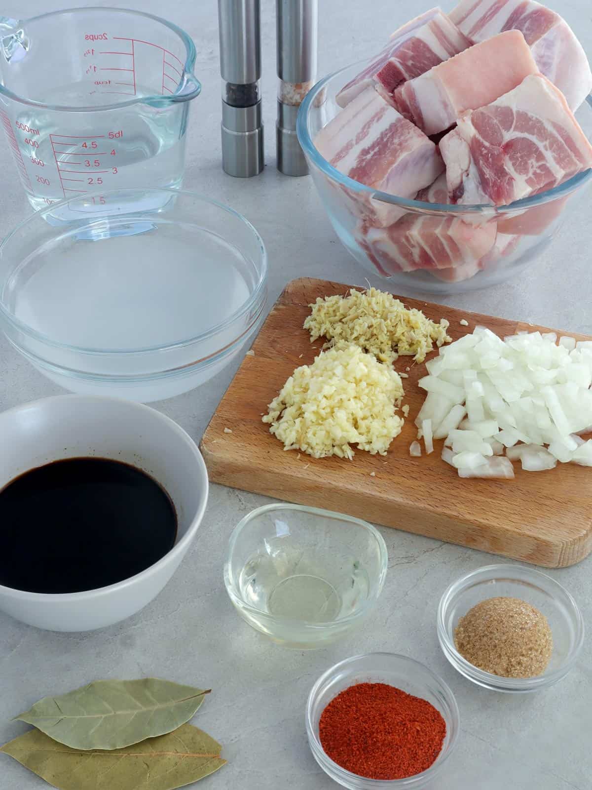 pork ribs, garlic, onions, atsuete, soy sauce, vinegar, water, salt, pepper, ginger, brown sugar