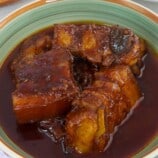 adobong pula in a serving bowl