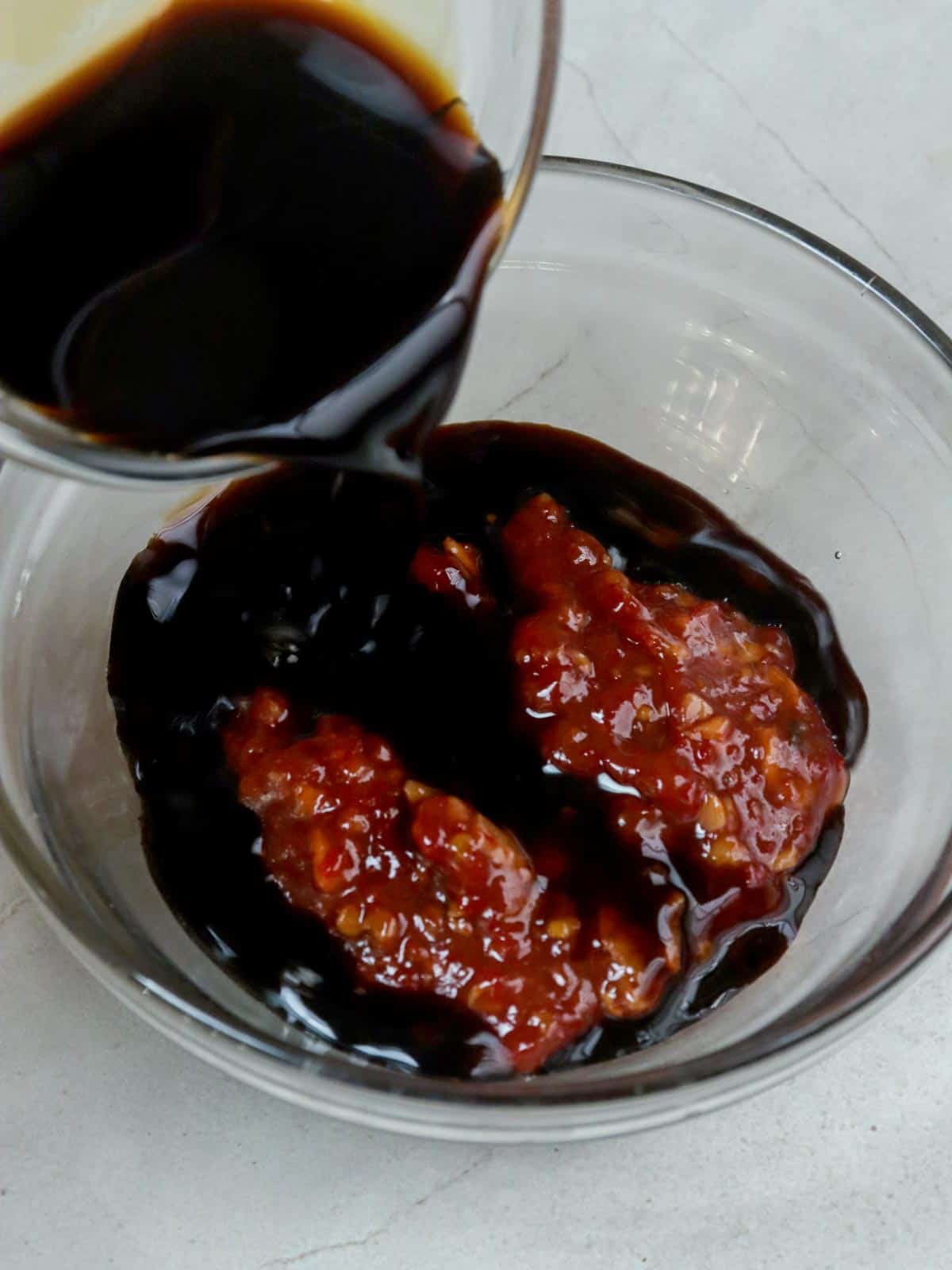 making spicy garlic sauce in a bowl