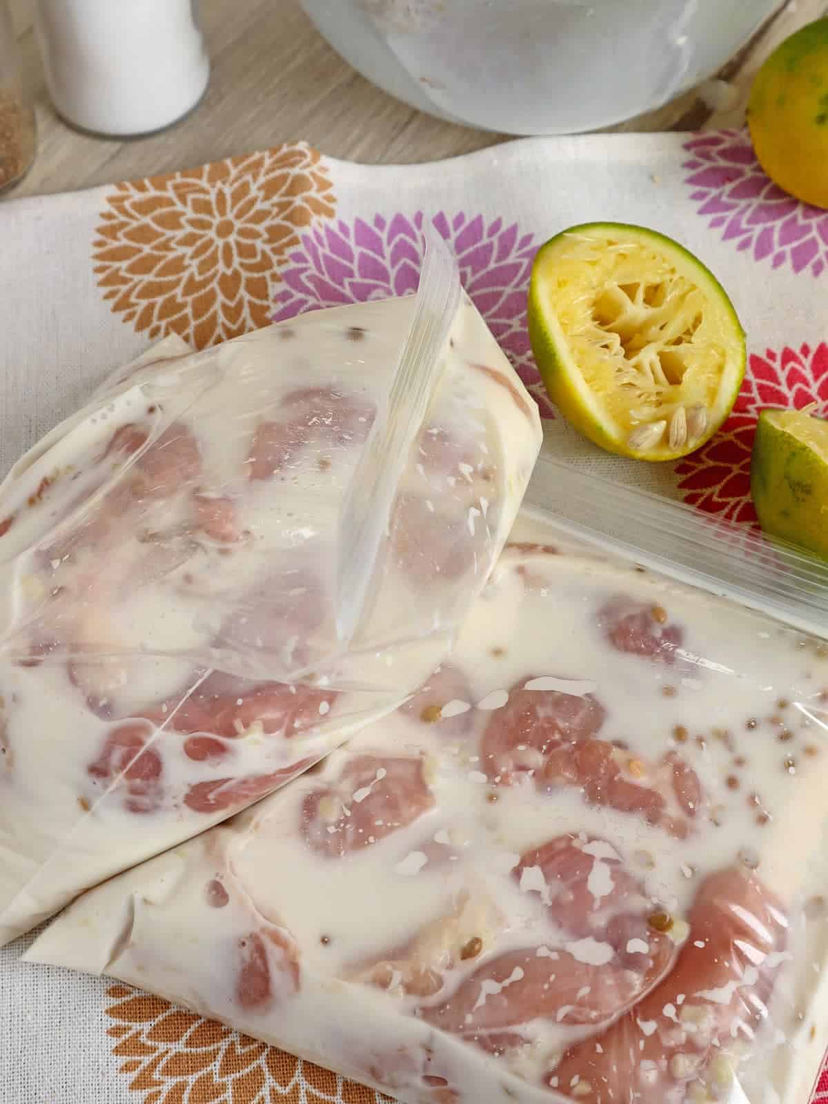 pouring coconut milk in a bowl of spices