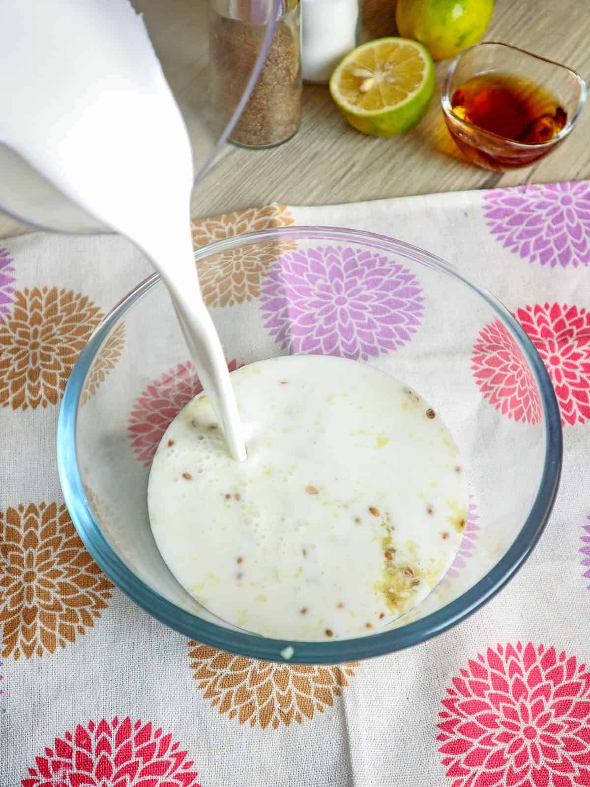 pouring coconut mik in a bowl 