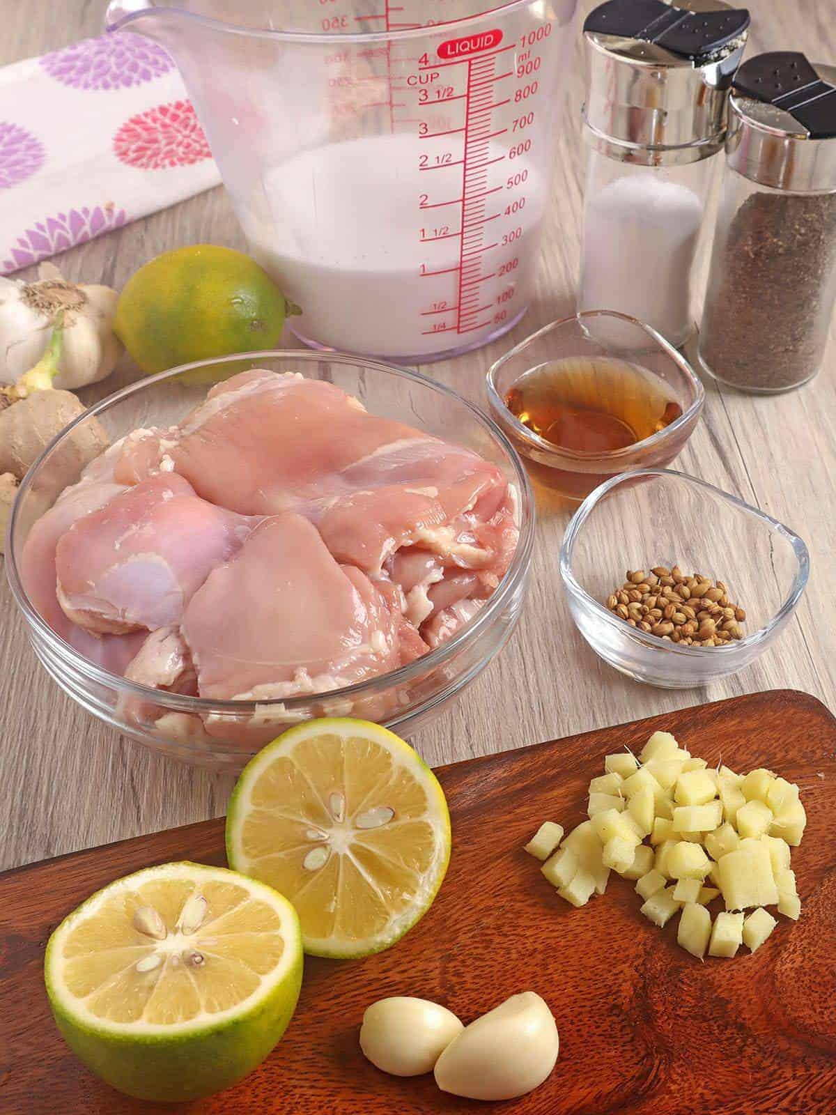 boneless, skinless chicken thighs, coconut milk, limes, garlic, ginger, and ground coriander