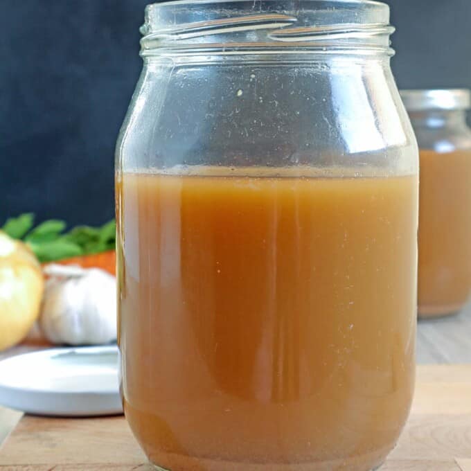 homemade shrimp stock in a mason jar