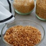 toasted coconut flakes in jars and bowl