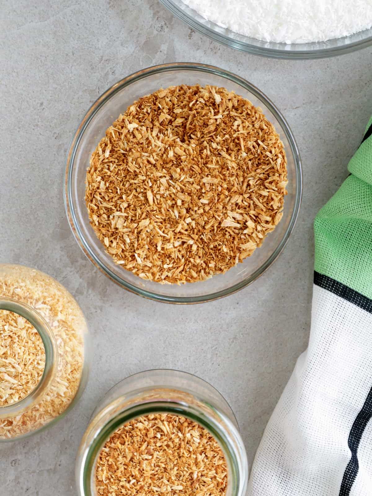 toasted coconut in bowl and jars