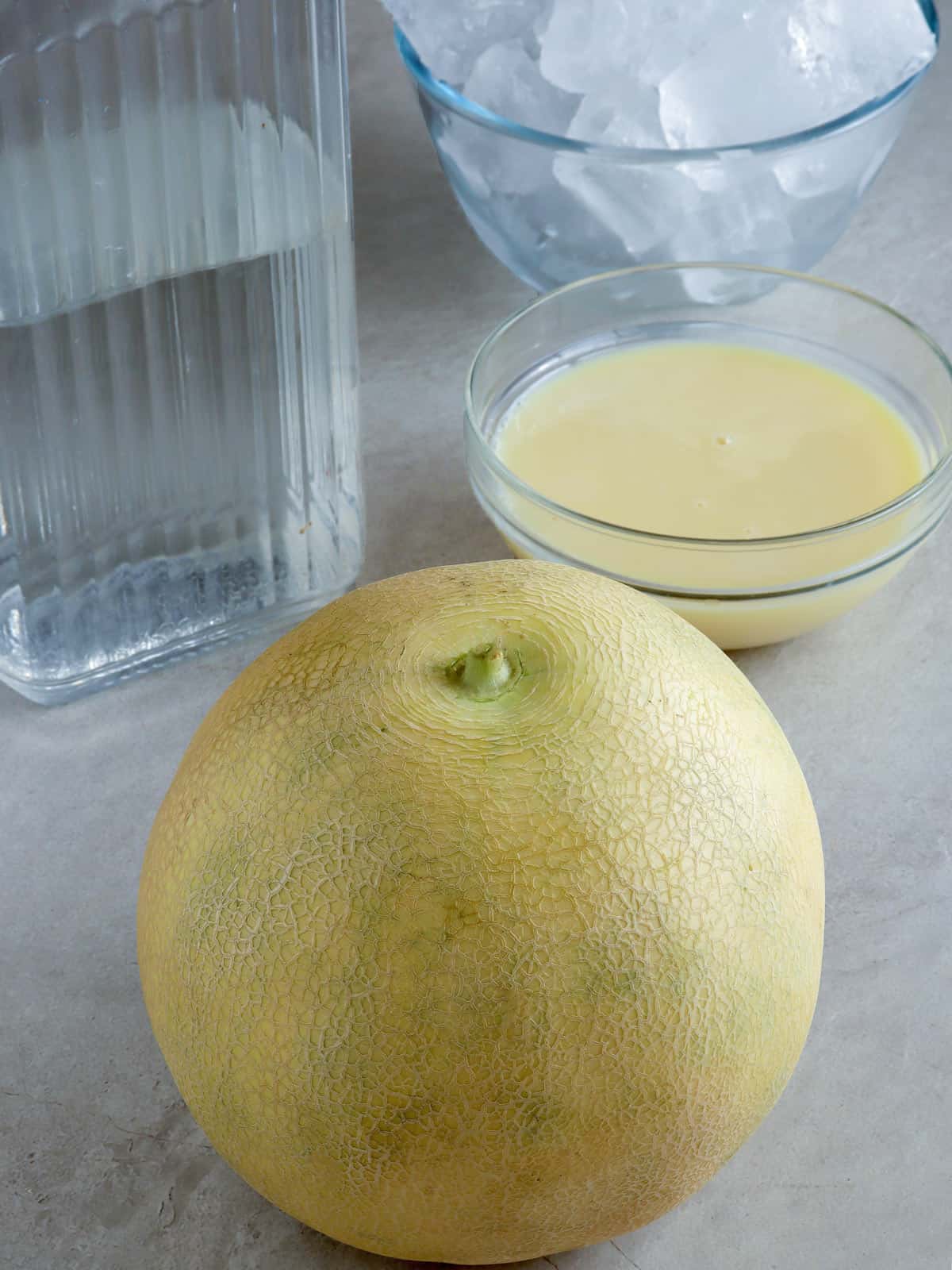 cantaloupe, condensed milk, water, and ice