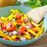 ensaladang manga with tomatoes in a serving bowl