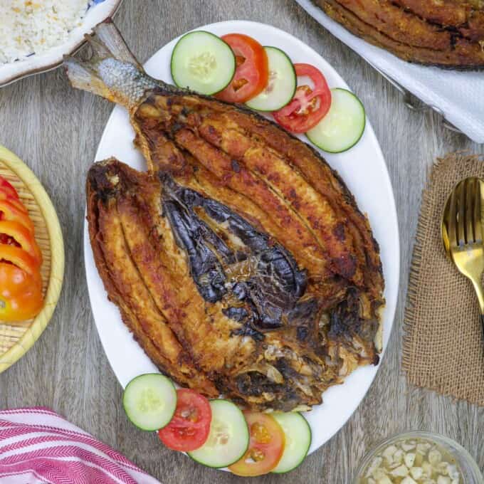 daing na bangus on a white serving platter.