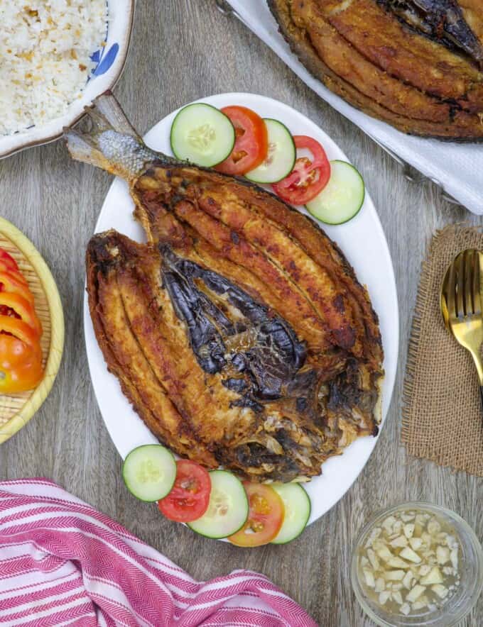 daing na bangus on a white serving platter.