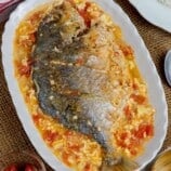 Cardillong Isda on a white serving platter with a side of steamed rice