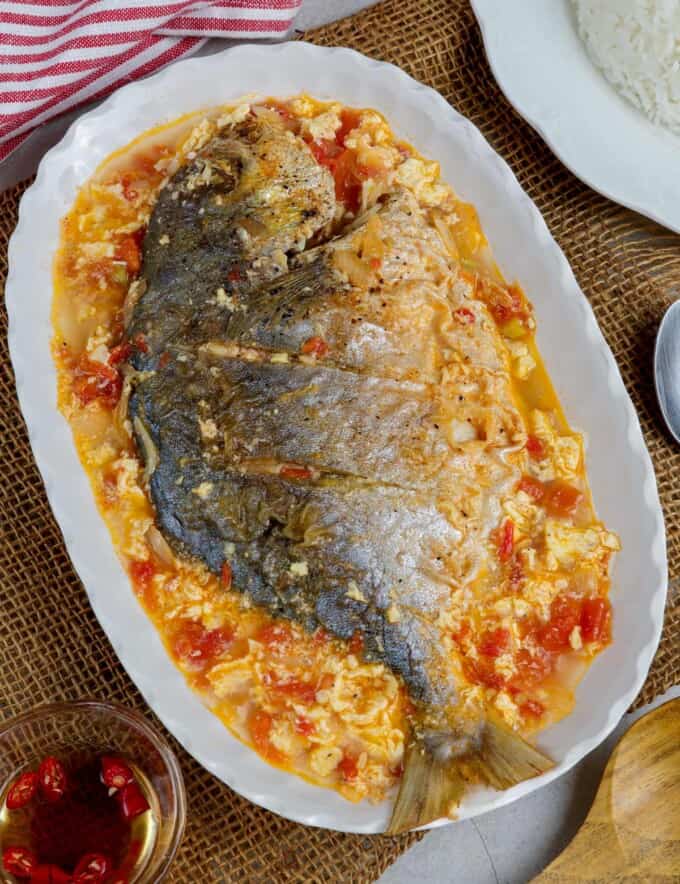 Cardillong Isda on a white serving platter with a side of steamed rice