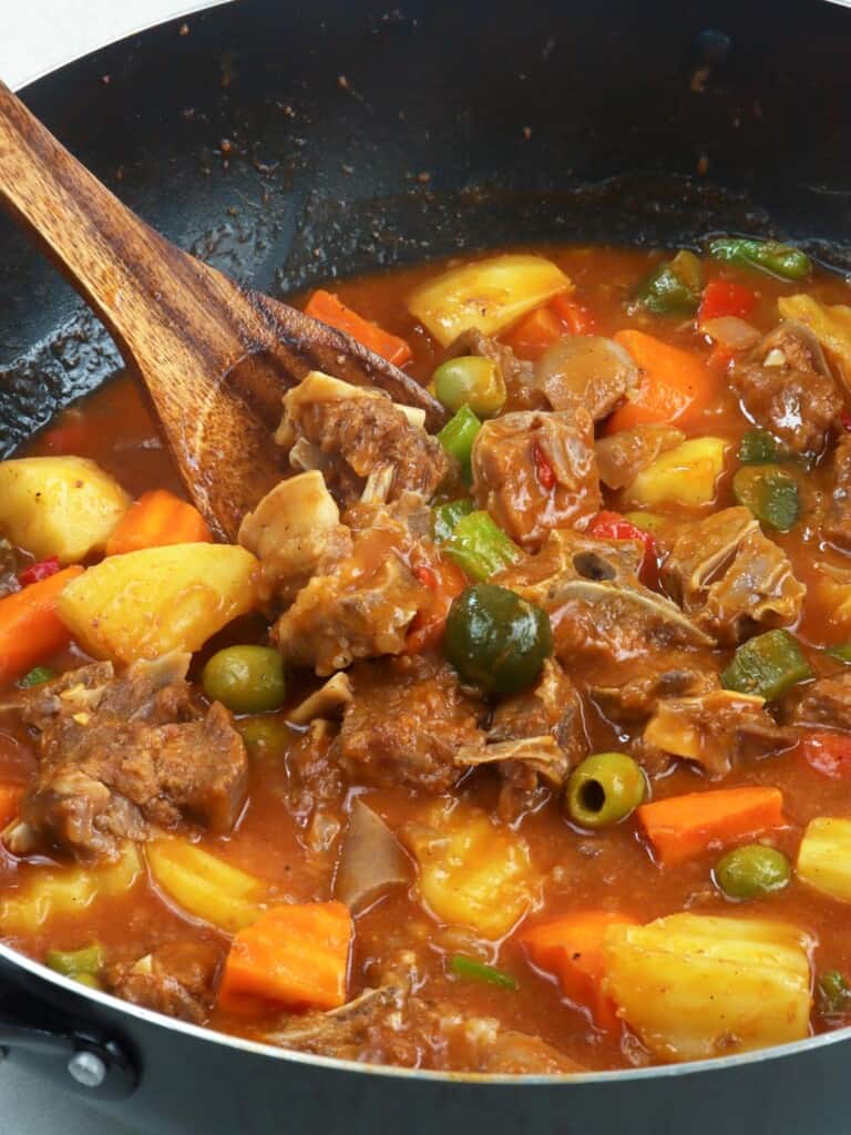 goat caldereta cooked in a pan