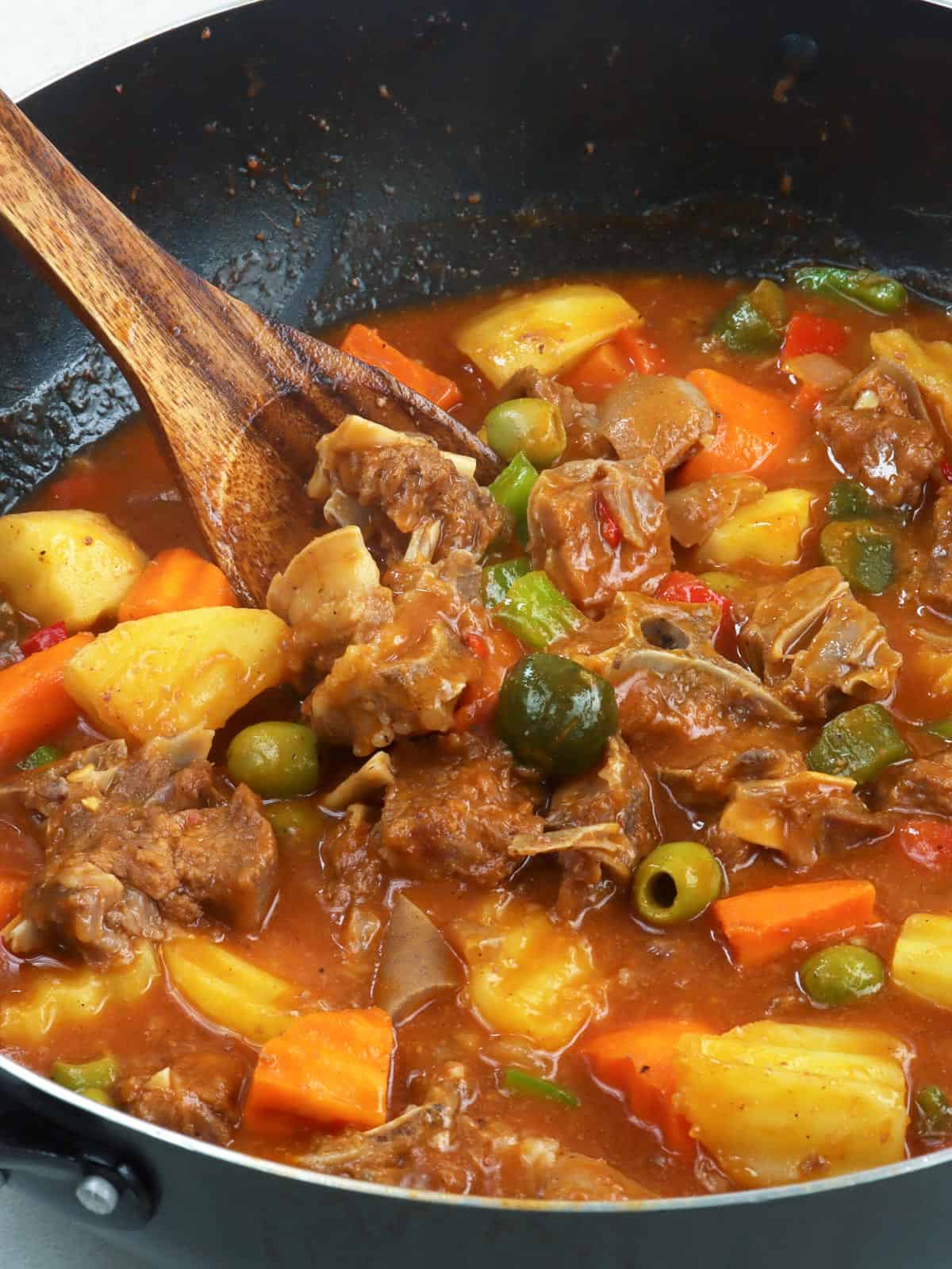 goat caldereta cooked in a pan