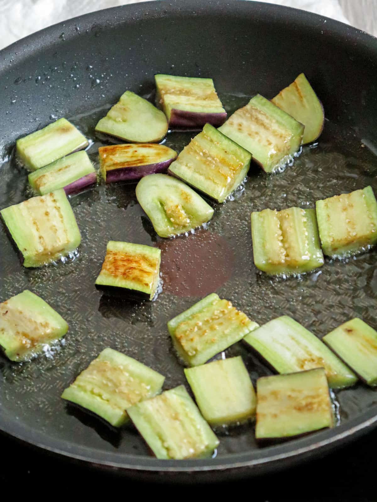 pan-frying eggplant in a skillet