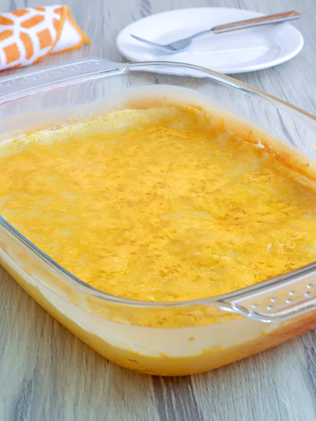 Royal Bibingka topped with cheese in a baking dish