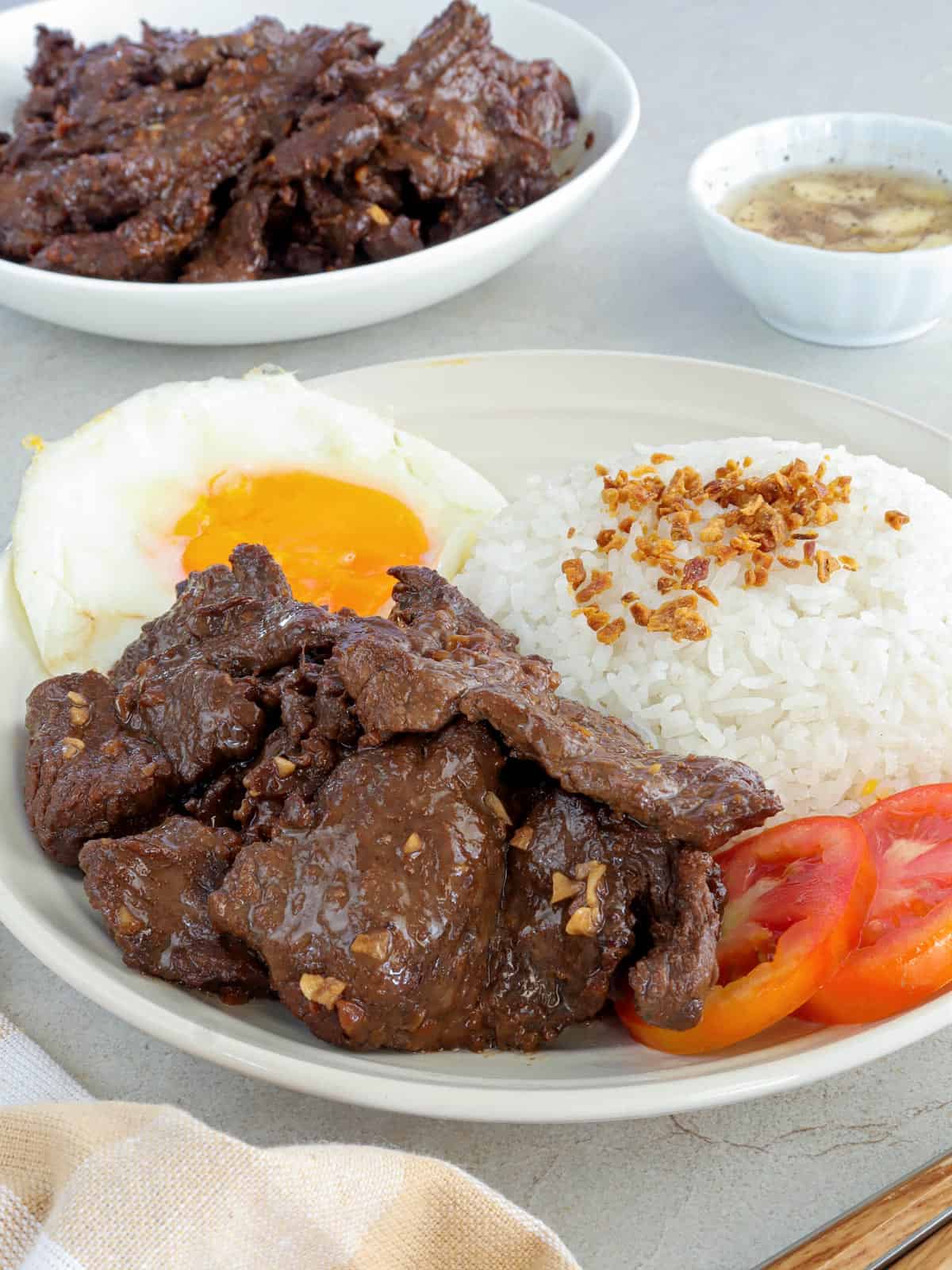 tapsilog on white plate.