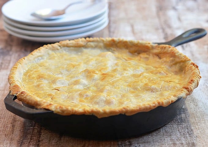 Chicken Pastel topped with pie crust in a cast iron skillet