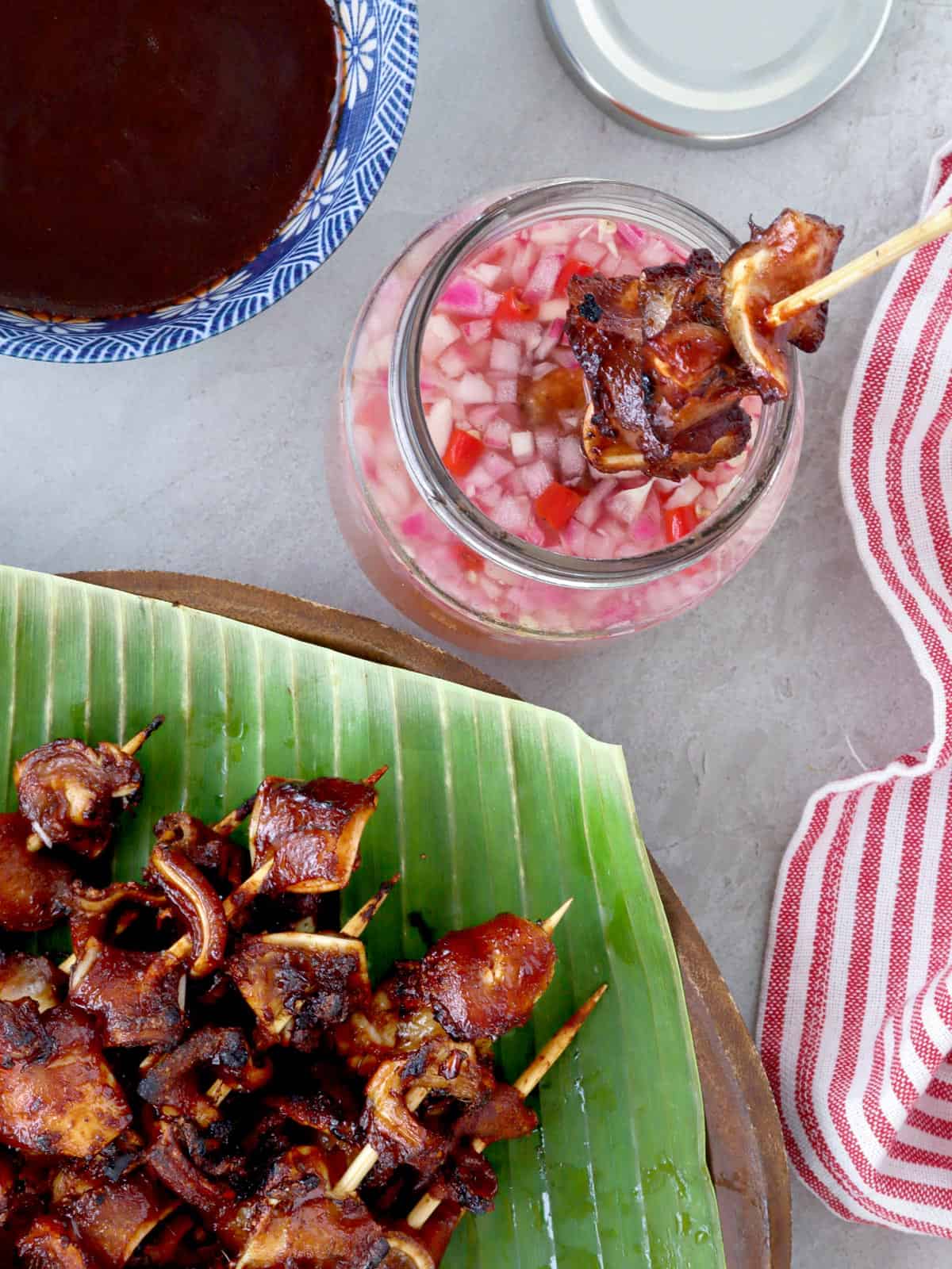 dipping pork ears barbecue in spicy vinegar
