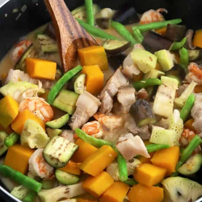 creamy vegetable stew in coconut cream with pork and shrimp in a pan