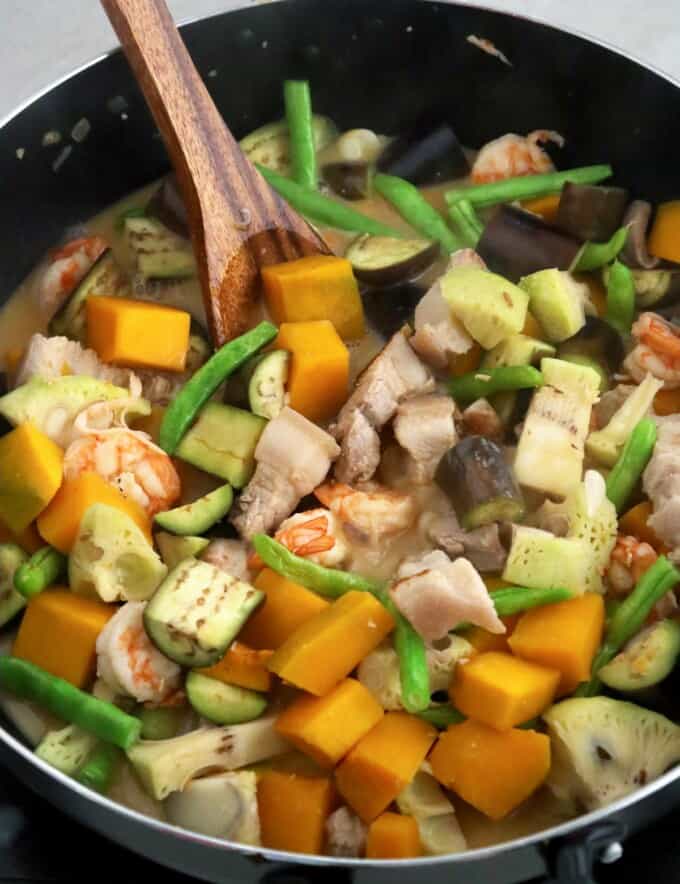 creamy vegetable stew in coconut cream with pork and shrimp in a pan