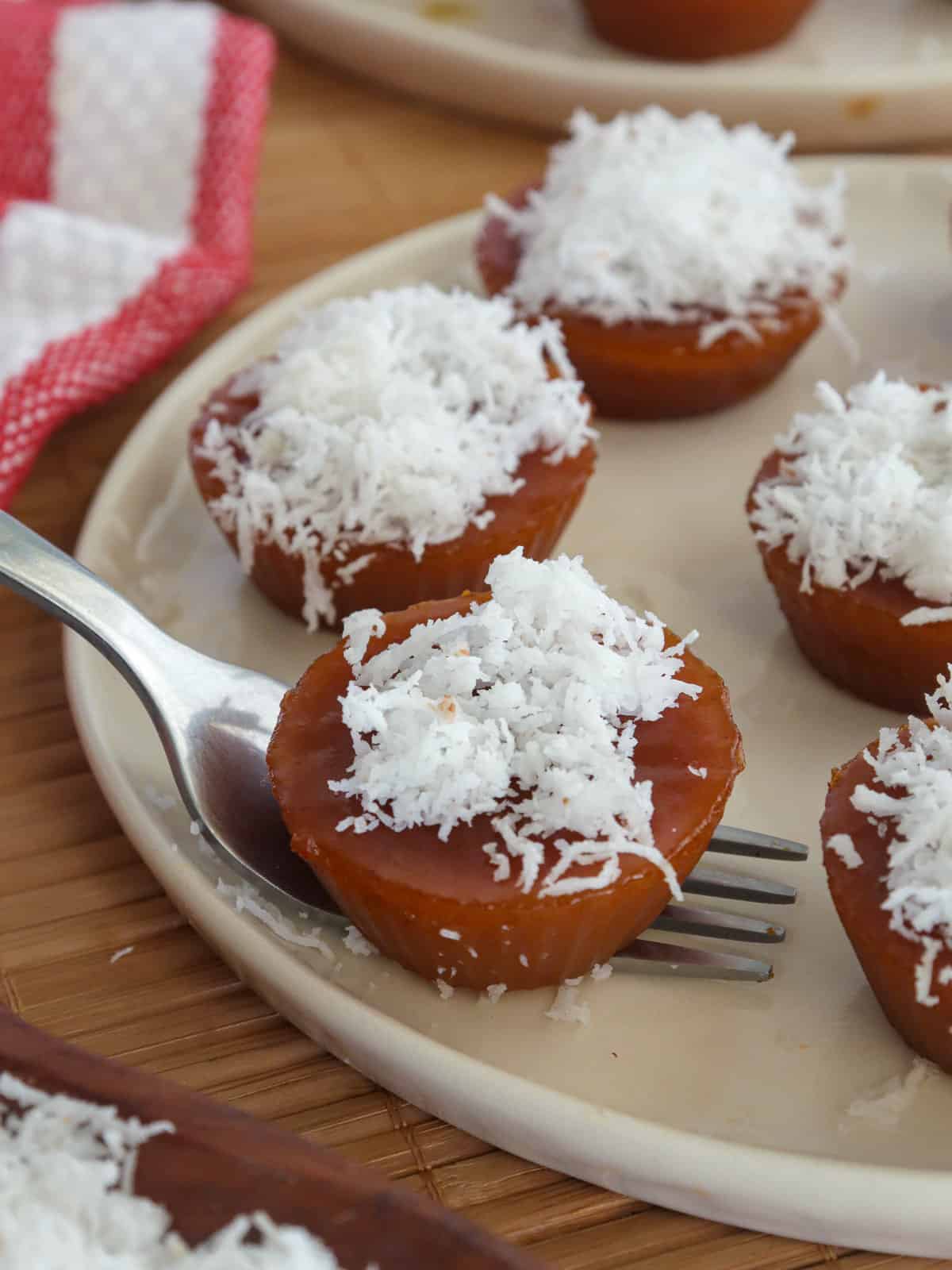 serving cuchinta with a fork on a white plate.