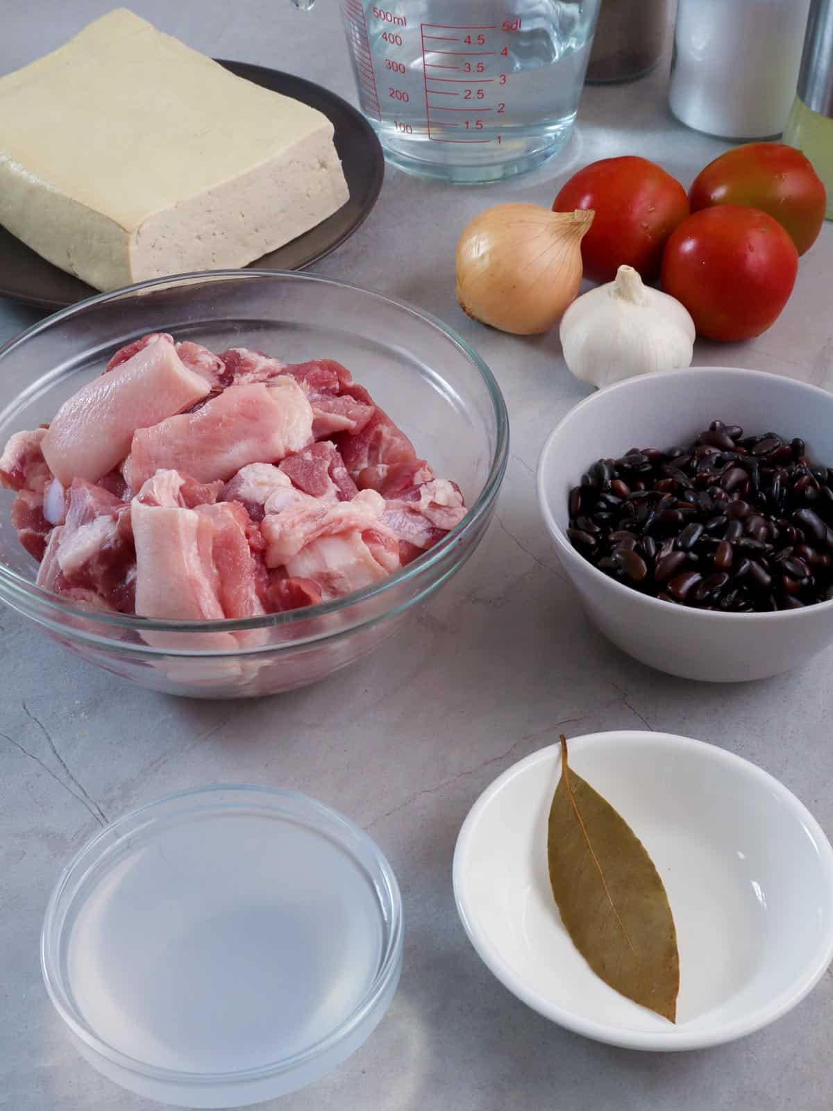 pork belly, firm tofu, tomatoes, onions, garlic, salted black beans, vinegar, bay leaf