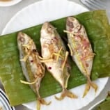 Banana-wrapped Salay-Salay Fish on a white plate