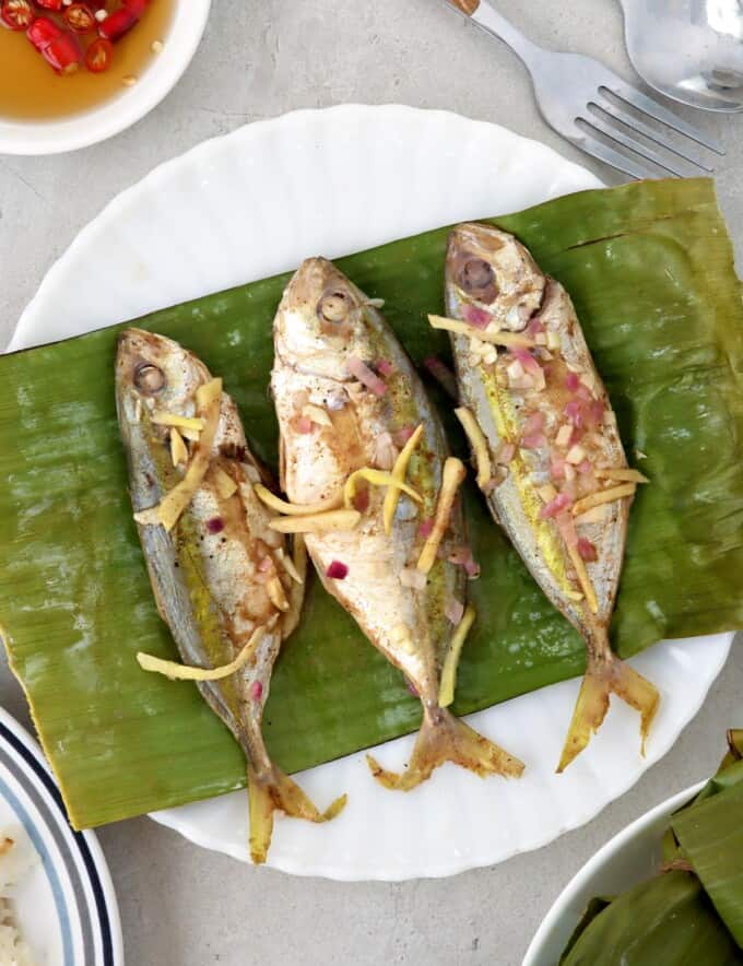 Banana-wrapped Salay-Salay Fish on a white plate