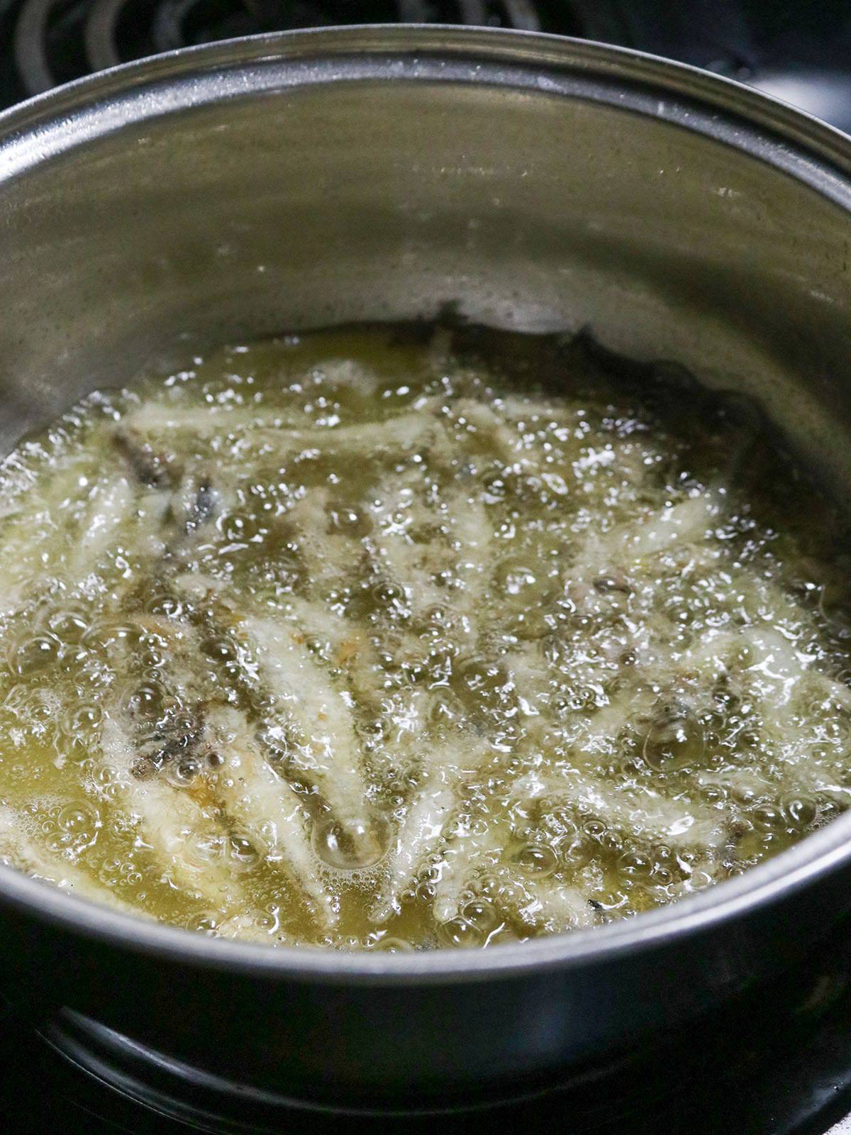 frying smelt fish in a hot oil