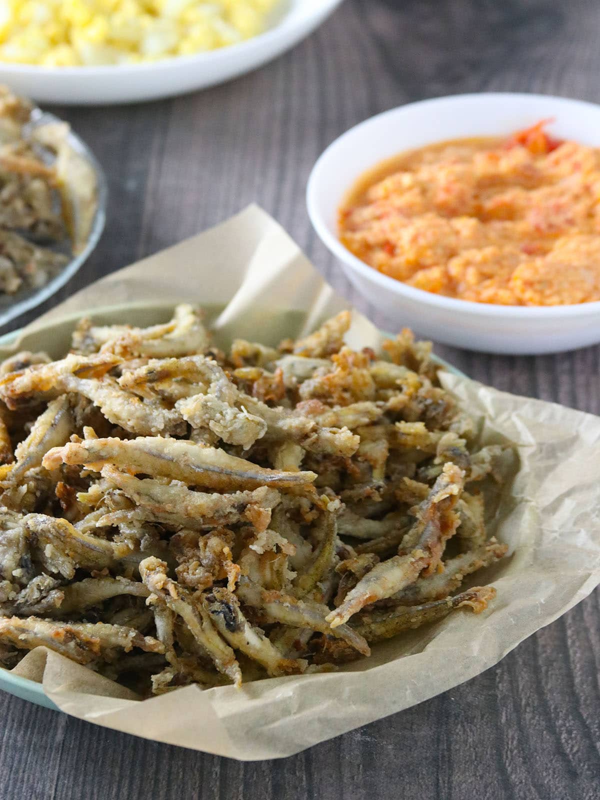 Crispy Fried Smelt Fish on a paper-lined bowl