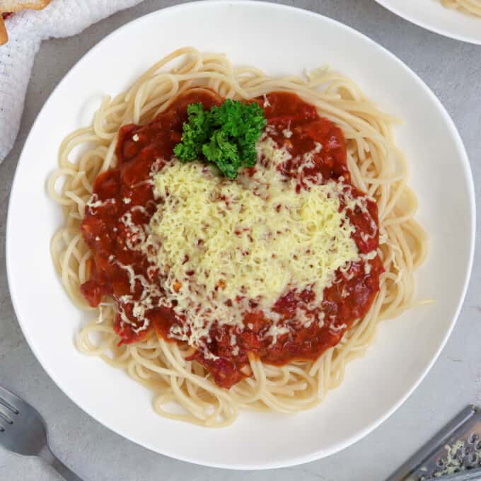 filipino-style spaghetti with corned beef on a white plate