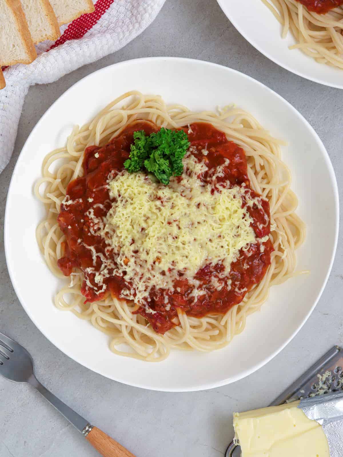 filipino-style spaghetti with corned beef on a white plate