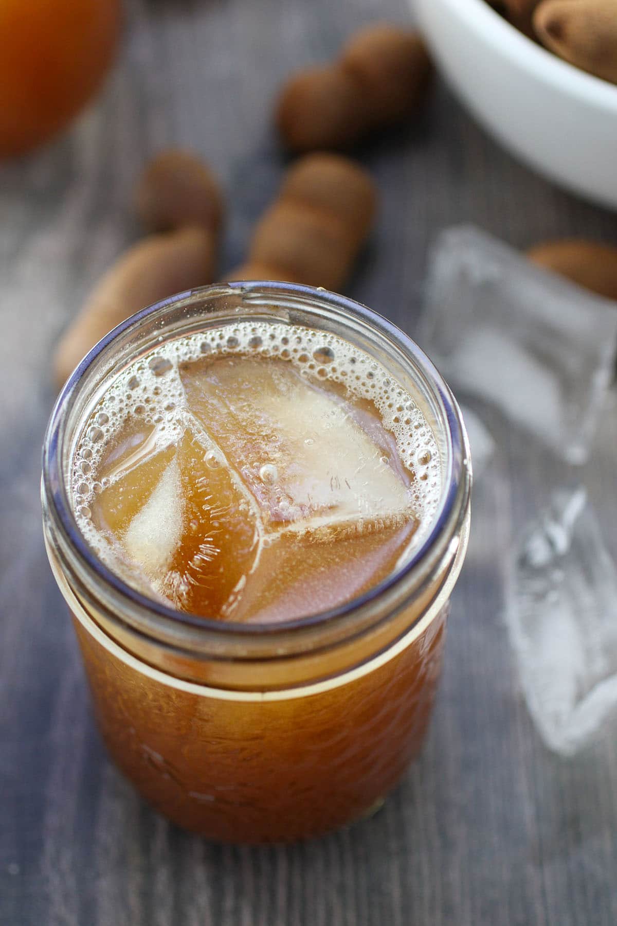 tamarind drink with ice in a clear glass