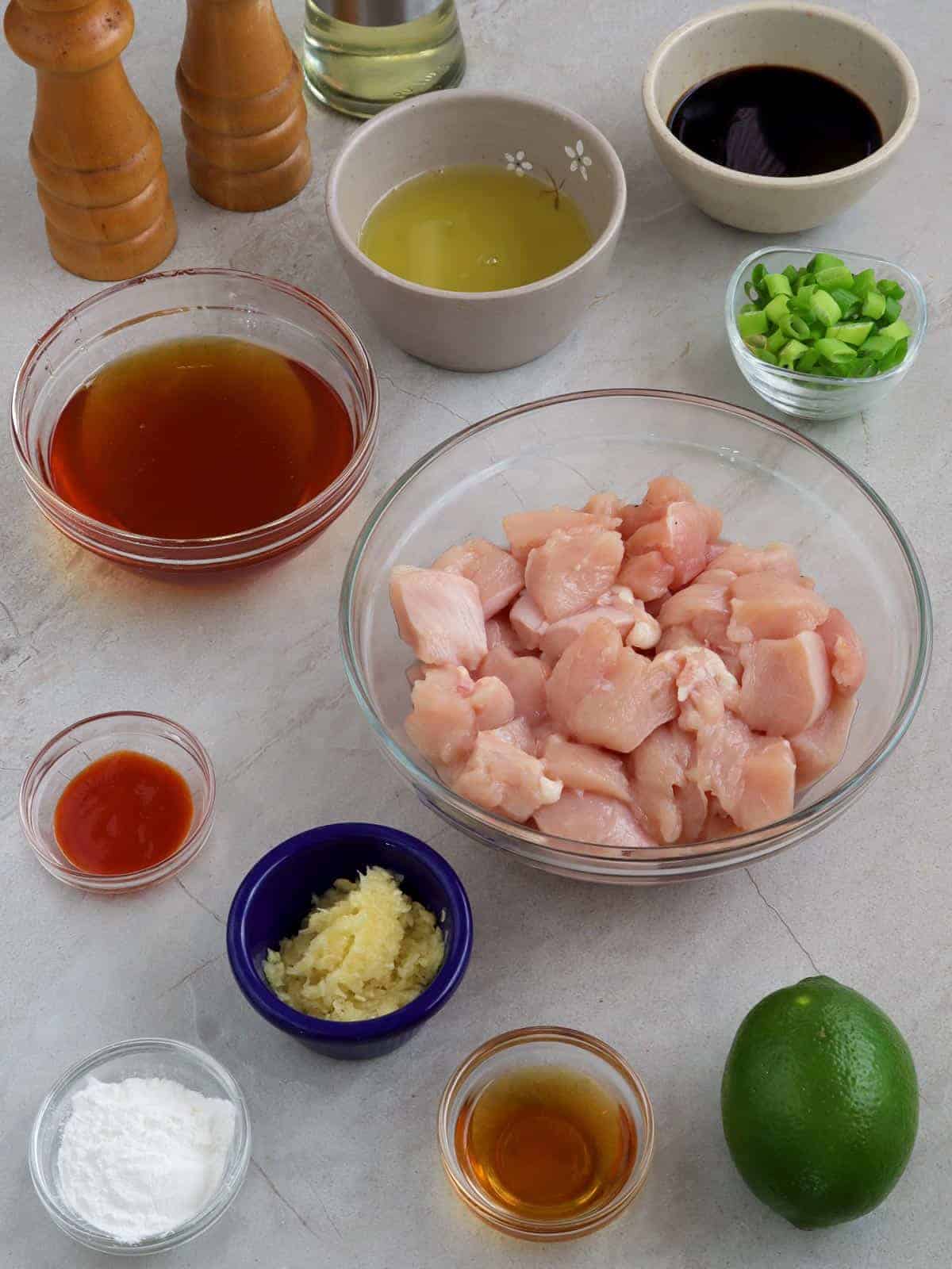 diced chicken breast, honey, lime, garlic, cornstarch, egg whites, Sriracha sauce, green onions, soy sauce in individual bowls