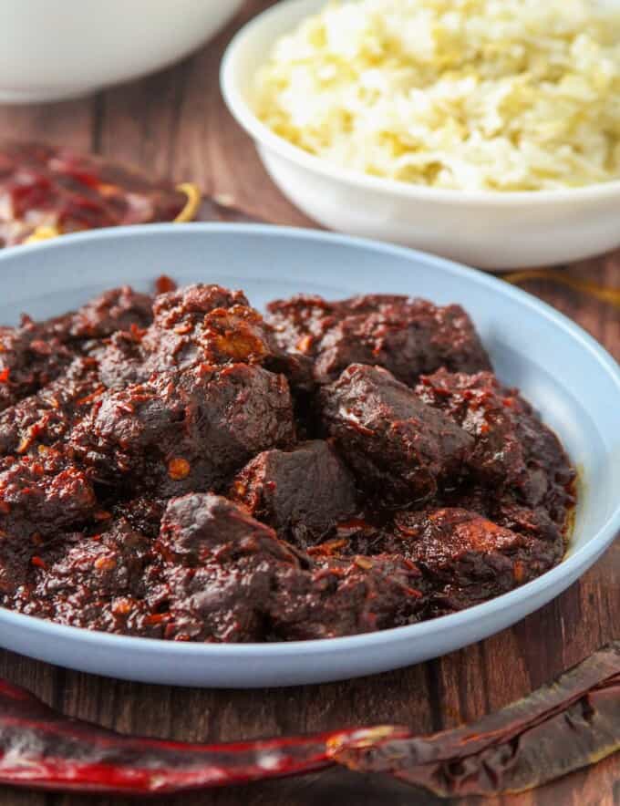 Mexican adobo in a blue serving bowl