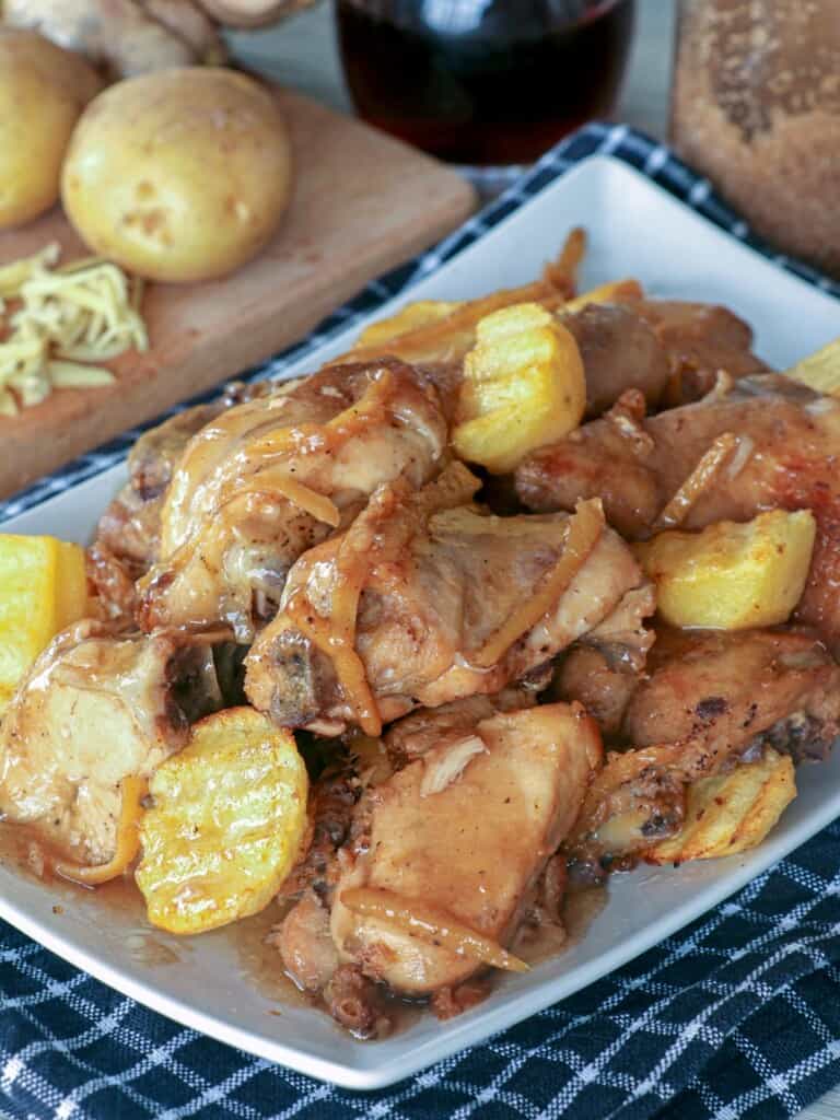 chicken and potato stew on a white serving platter