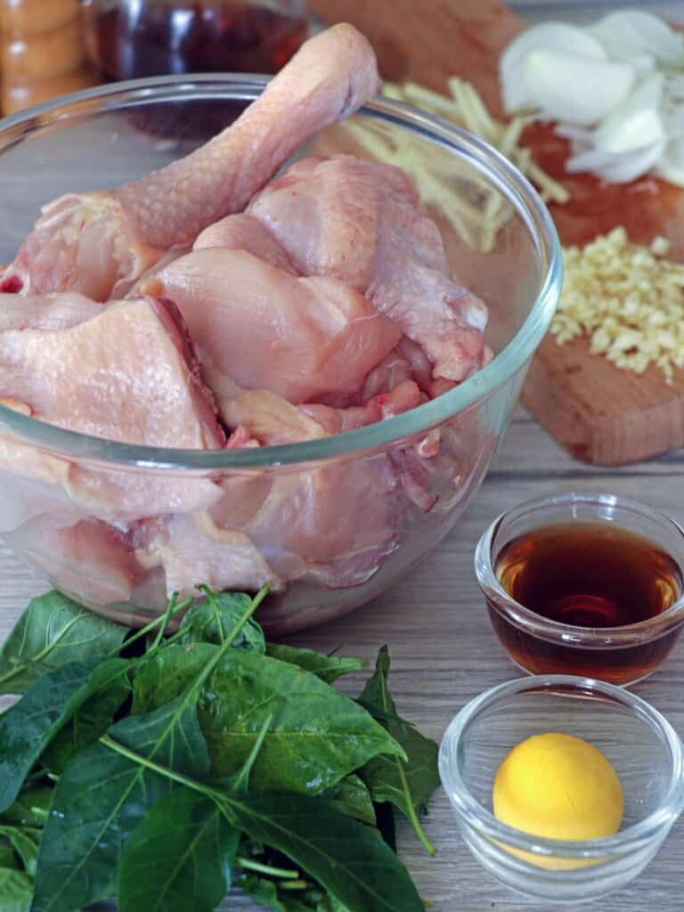 cut-up chicken, fish sauce, chili leaves, eggs, chopped onions, minced garlic, julienned ginger