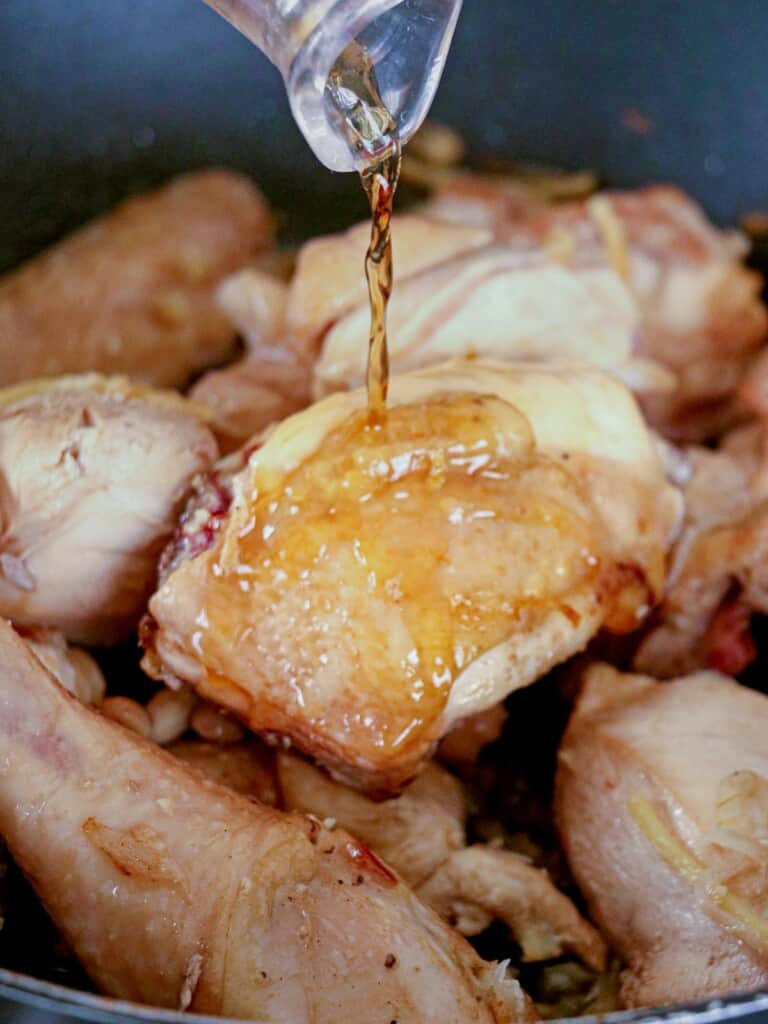 pouring fish sauce on chicken