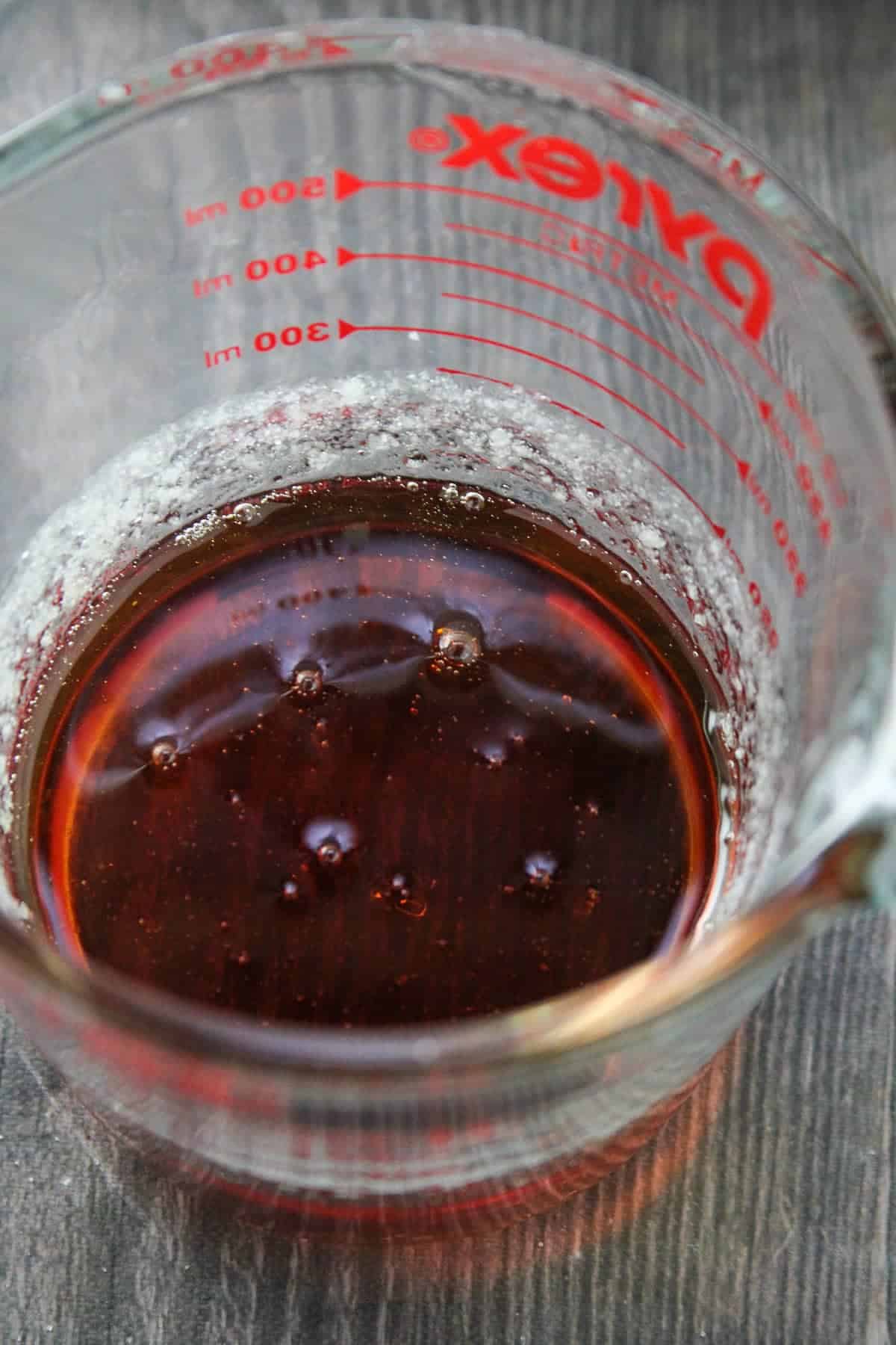 caramelized sugar in a glass measuring cup