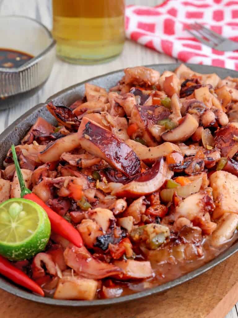 spicy sizzling squid on a sizzling plate