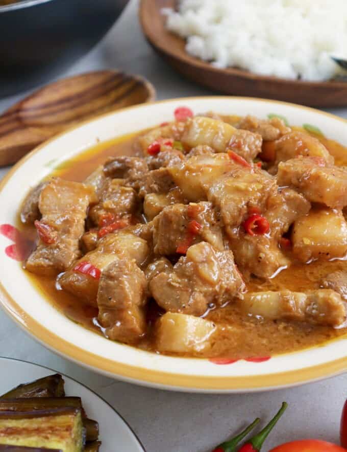 Binagoongan Baboy sa Gata in a white serving bowl