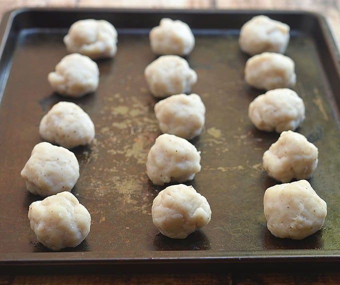 fishballs in a single layer on a baking dish