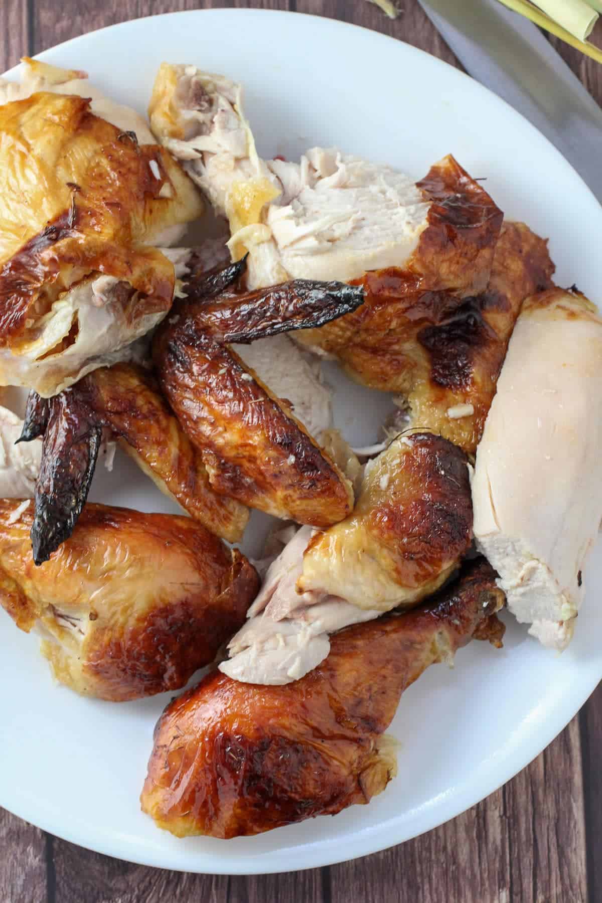 chopped roasted chicken on a white serving platter